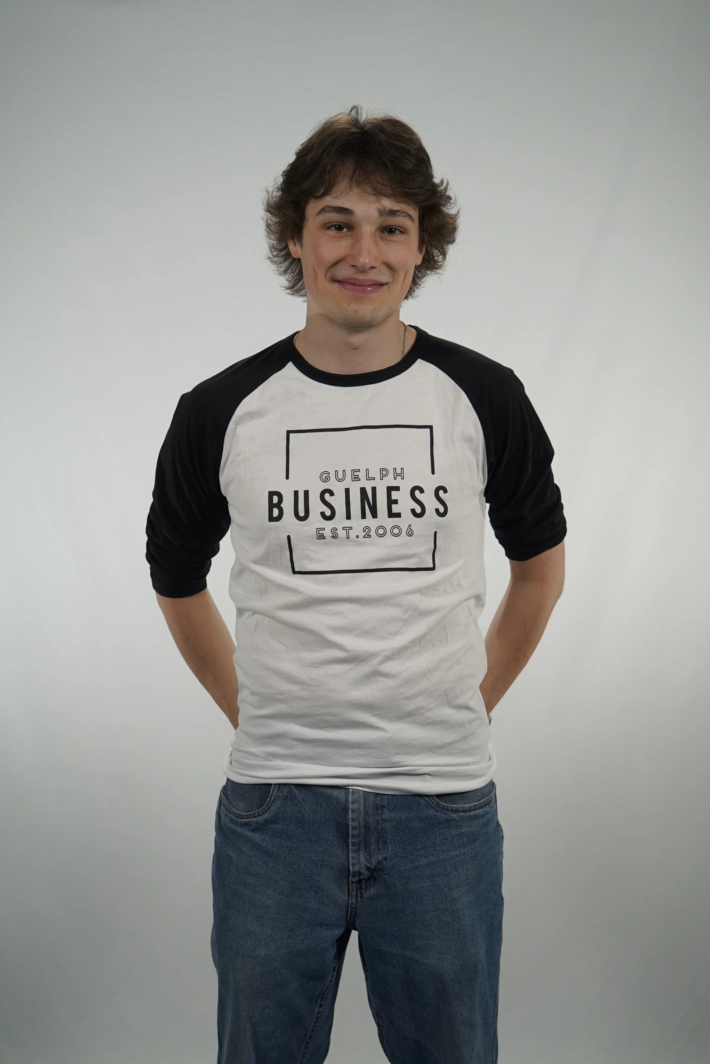 Student wearing a Guelph Business raglan